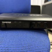 SHURE BLX14E-H8E BLX szett: zsebadó, vevő, WA302 + Shure WCM16 fejmikrofon